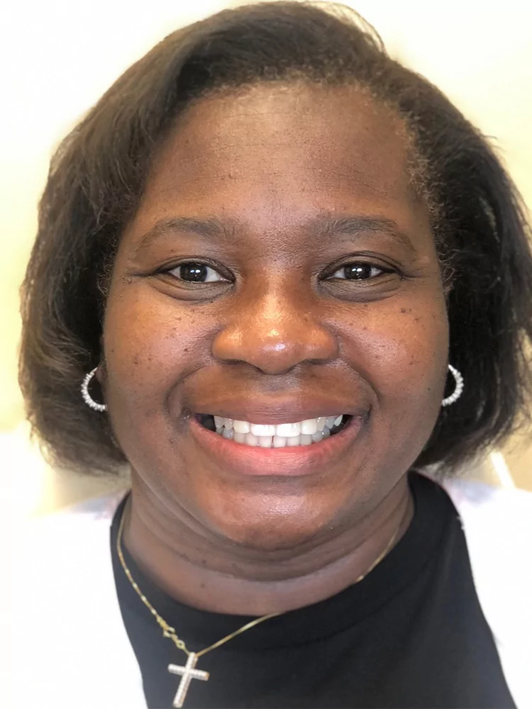 woman smiling after dental veneers