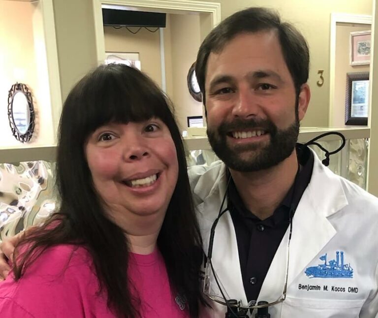 dr kacos smiling with dental bridges patient