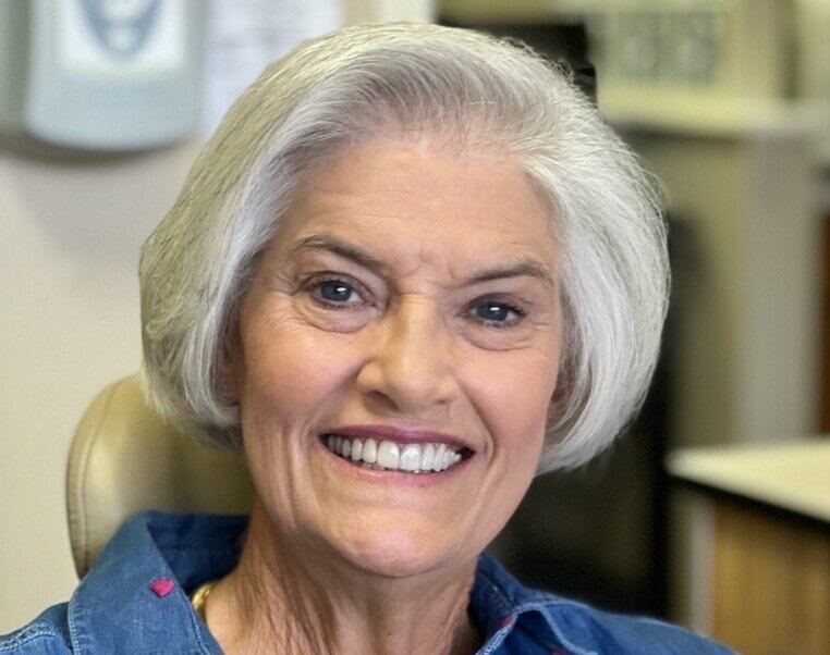 patient smiling after dental crown treatment