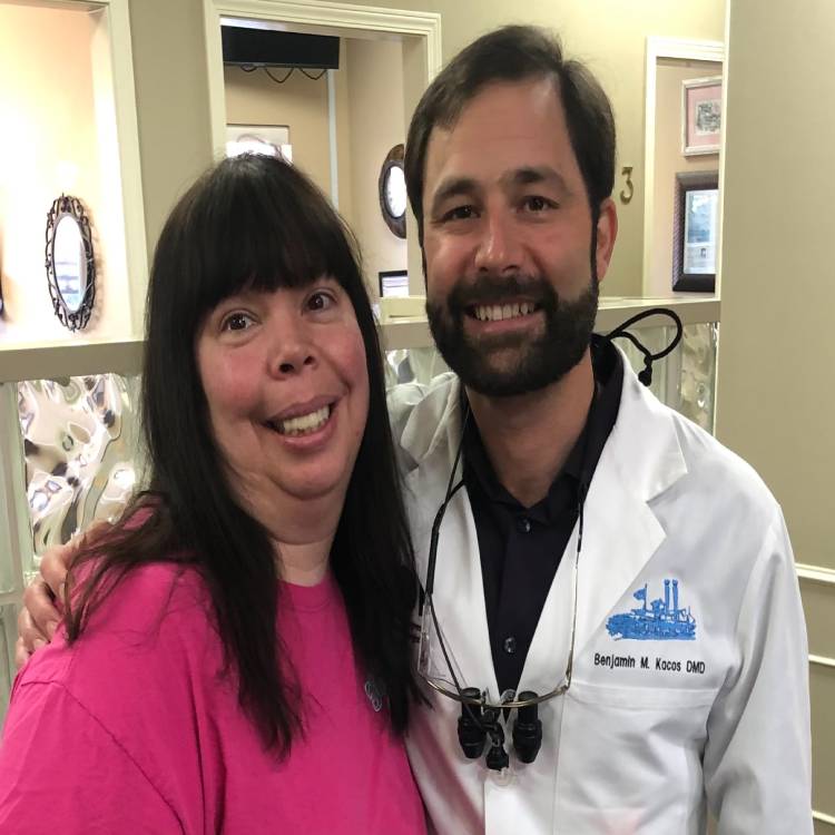 Dr. Kacos posing with smile makeover patient